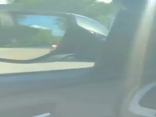Grand MILF escort Touches Her Pussy In Public While Driving Squirts All Over The Car